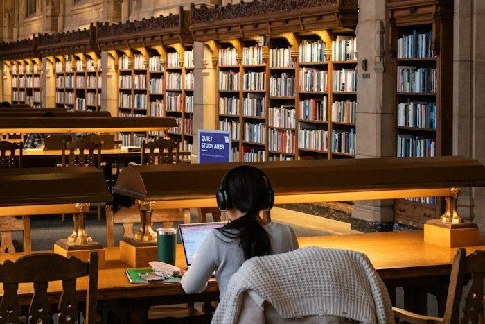 Student researching in a library
